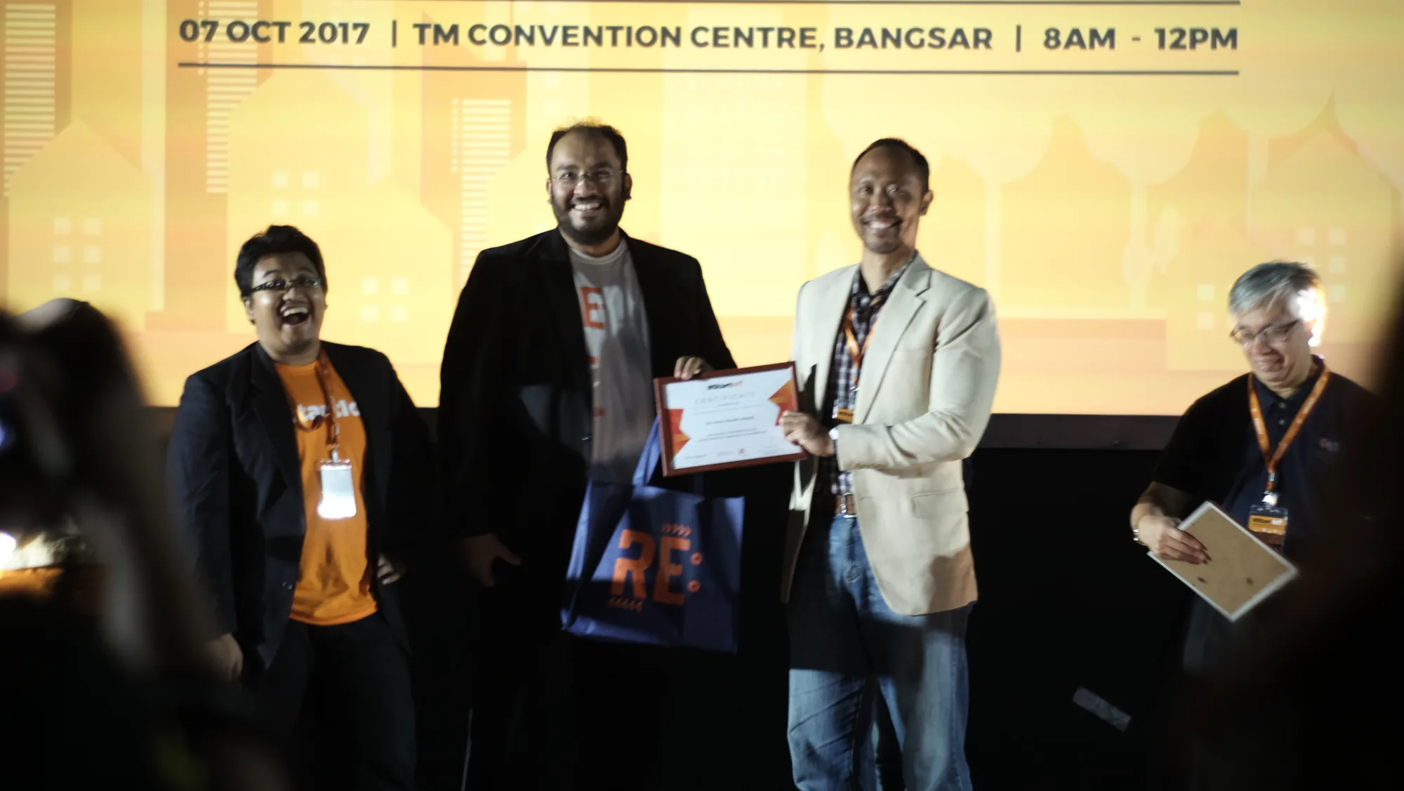 Participants receiving recognition on stage at StartIoT in 2017