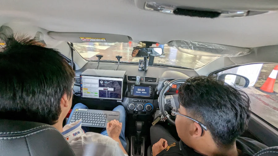 REKA archive photograph. Actual vehicle-interior scene from the Malaysia Autoshow 2023 article. No claim that these occupants are members of the public or that this is the 2017 ride.